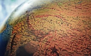 Explore the intricate details of China and neighboring regions in this vintage-style globe photo.